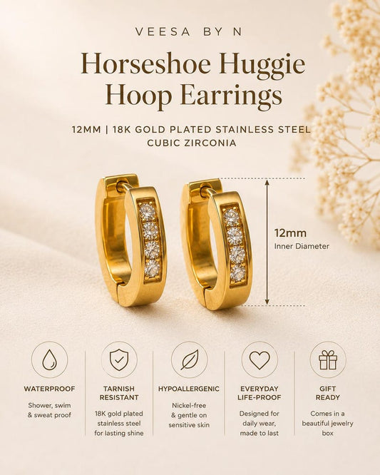Gold horseshoe huggie hoop earrings detail