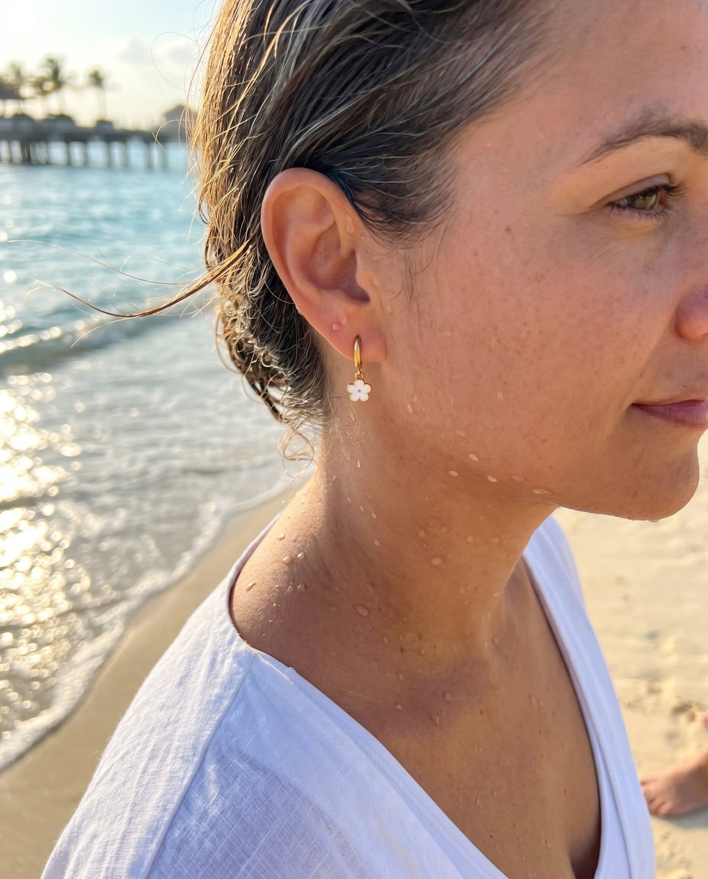 Daisy Huggie Hoop Earrings — Gold, White Enamel Flower Charm