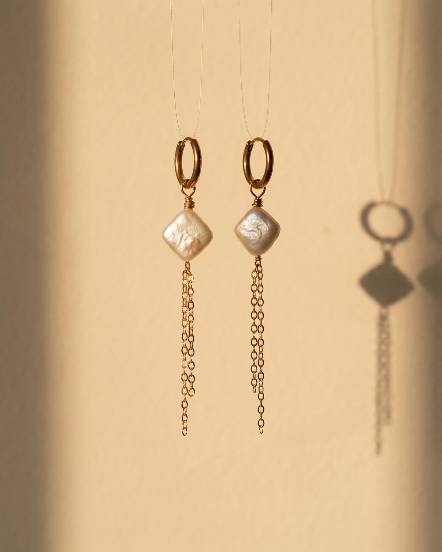 Gold huggie hoop earrings with square pearl and chain dangle, minimalist dainty jewelry