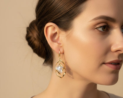 Gold crystal drop earrings worn on model – side profile showing 5cm drop length