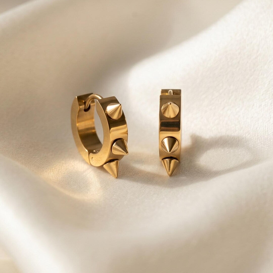 Gold spiky huggie hoop earrings 8mm — edgy minimalist stainless steel on white background