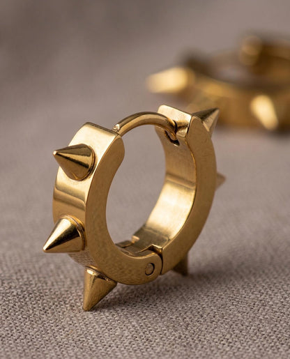 Gold spiky huggie earrings ear stack styling — layered with other huggie hoops