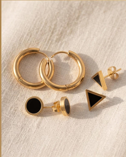 Gold earring set worn ear stack styling