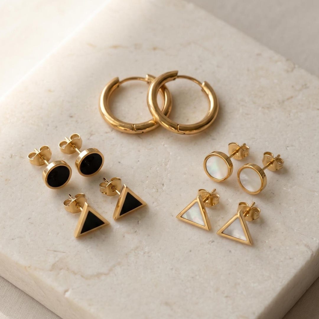 Gold hoop and geometric stud earrings set - black onyx style flat lay