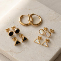 Gold hoop and geometric stud earrings set - black onyx style flat lay