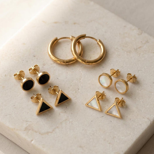 Gold hoop and geometric stud earrings set - black onyx style flat lay