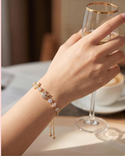 Gold kitty cat bracelet flat lay