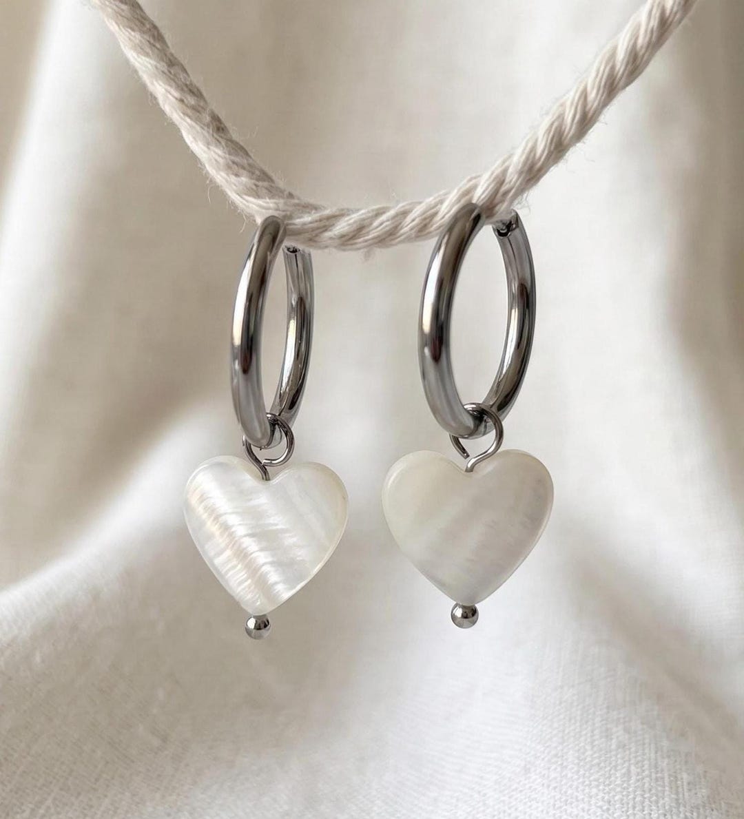 Mother of Pearl Heart Earrings on silver hoops