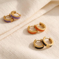 Black, purple, and orange enamel huggie hoop earrings