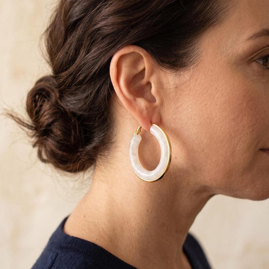 White gold hoop earrings worn