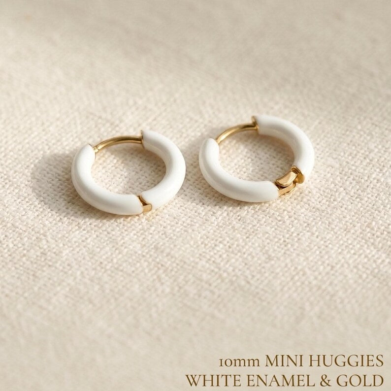 White enamel huggie hoop earrings in gold stainless steel