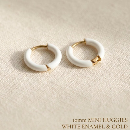 White enamel huggie hoop earrings in gold stainless steel