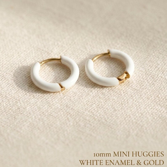 White enamel huggie hoop earrings in gold stainless steel