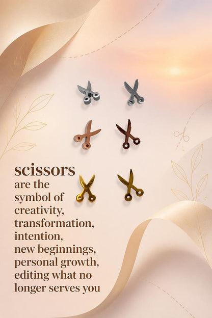 Silver scissors stud earrings product flat lay