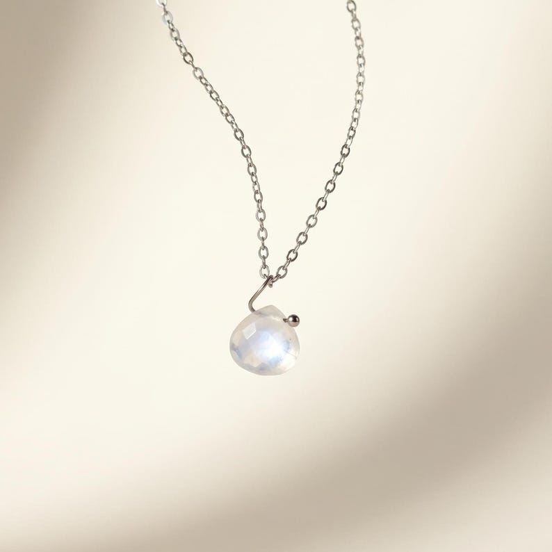 Floating moonstone pendant necklace on gold stainless steel adjustable chain