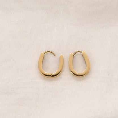 Gold horseshoe huggie hoop earrings final view