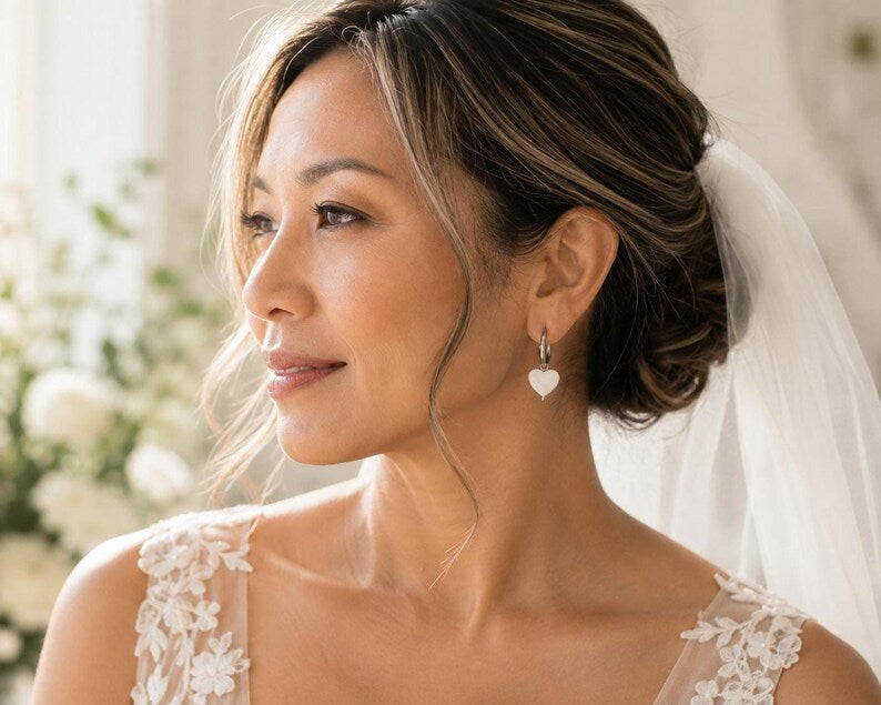 Bride wearing Mother of Pearl heart earring