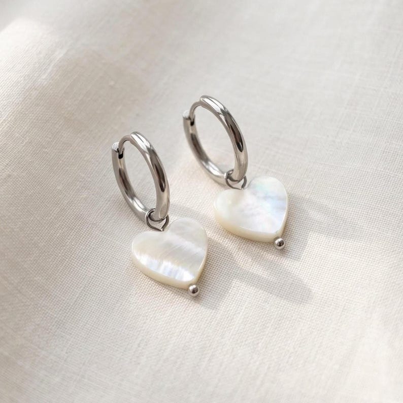 Mother of Pearl heart earrings angled view