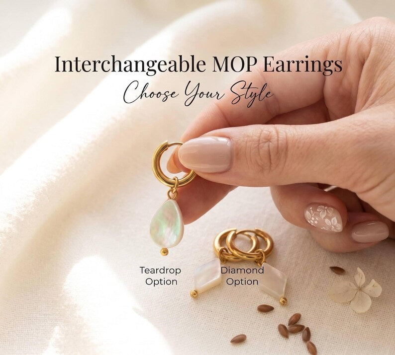 Hand holding teardrop and diamond MOP charm earrings