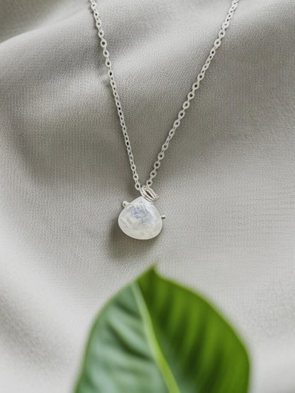 Silver moonstone necklace on fabric
