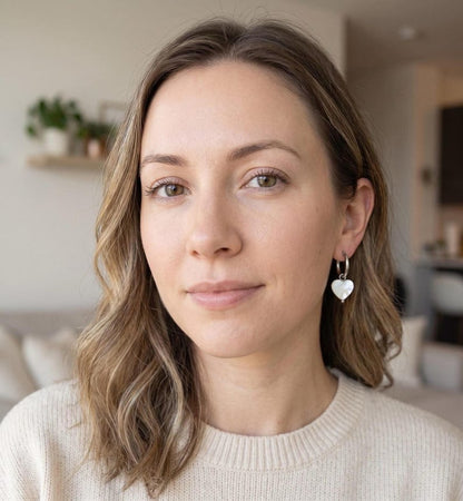 Model wearing Mother of Pearl heart earring
