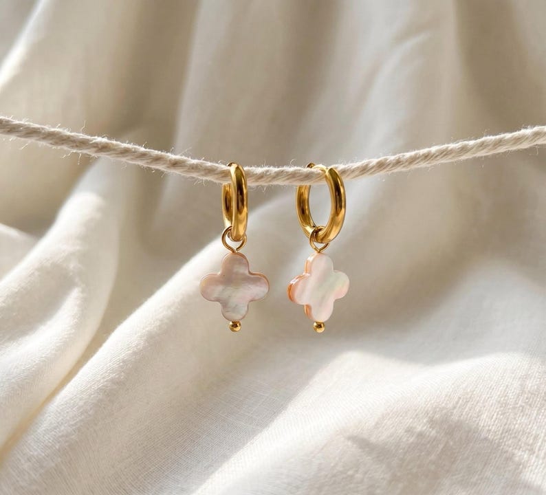 Mother of Pearl clover earrings hanging on rope