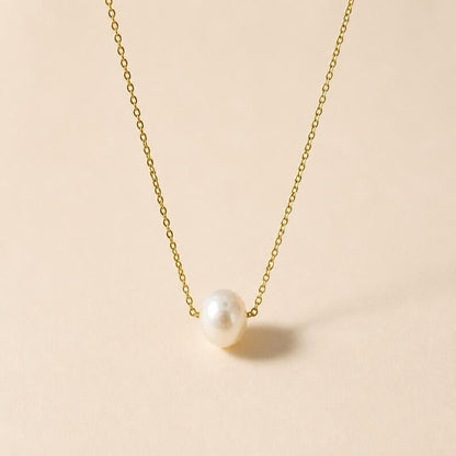 Gold chain necklace with single pearl pendant