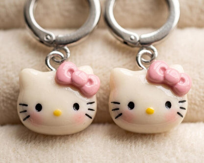 Close up of kitty charms with pink bows