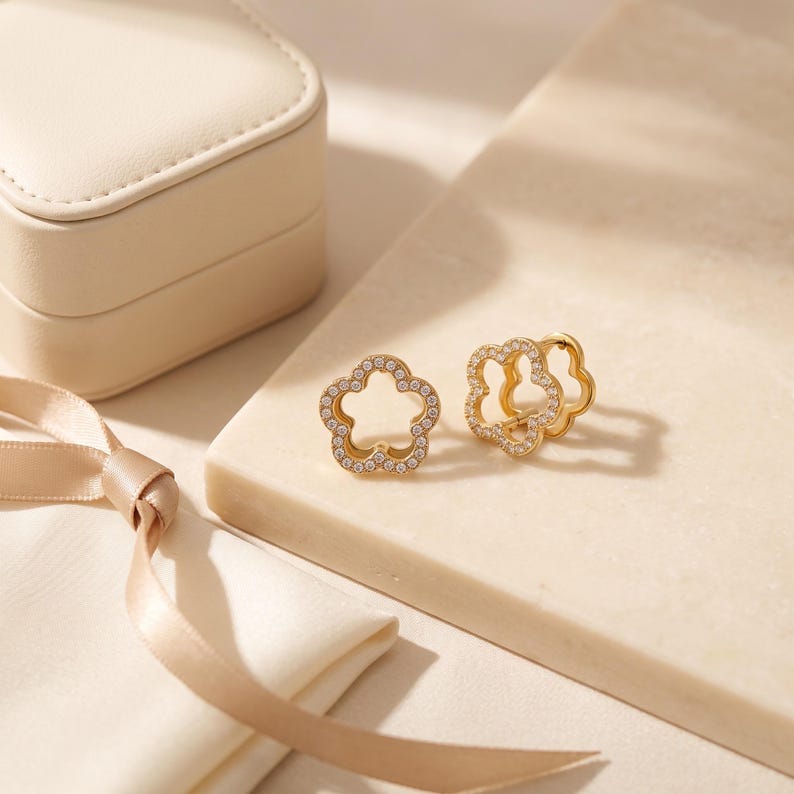 Gold flower pave earrings with leather jewelry box