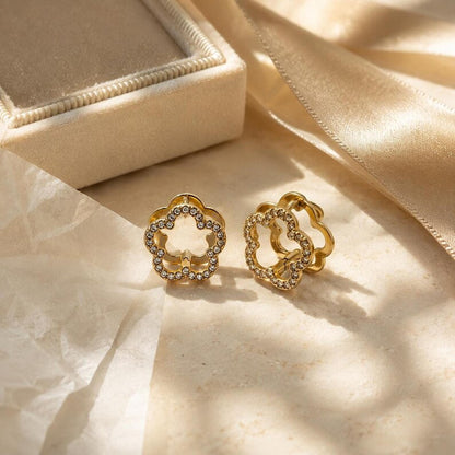 Gold flower hoop earrings with cream jewelry box and ribbon