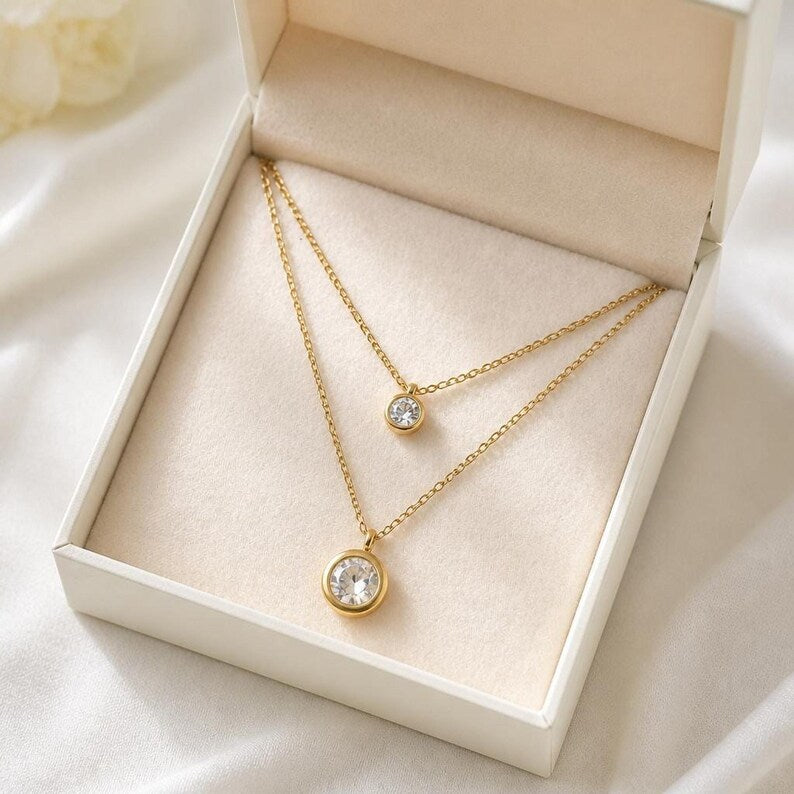Layered gold CZ necklace in jewelry box