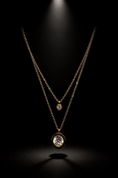 Layered gold CZ necklace on black background