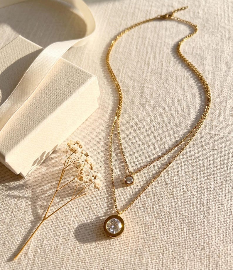 Layered gold CZ necklace with gift box and flowers