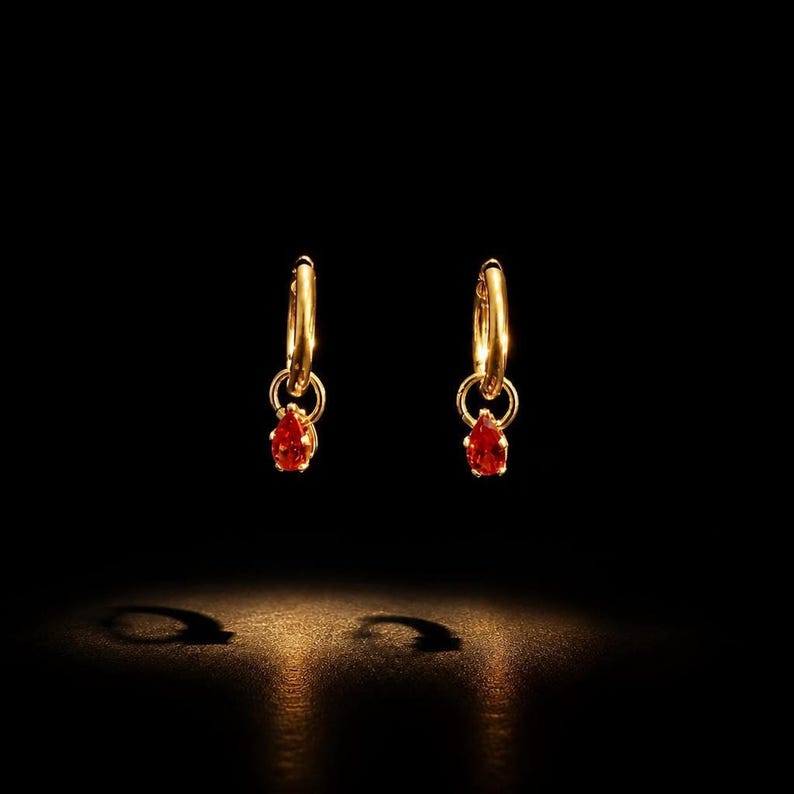 CZ huggie hoop earrings with dramatic spotlight