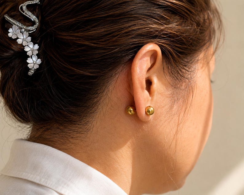 Close up of 8mm gold ball stud earring