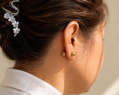 Close up of 8mm gold ball stud earring