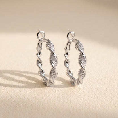 Silver twisted crystal pave hoop earrings