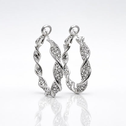 Close-up of twisted crystal pave hoop earring