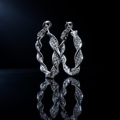 Twisted crystal pave hoop earrings studio shot