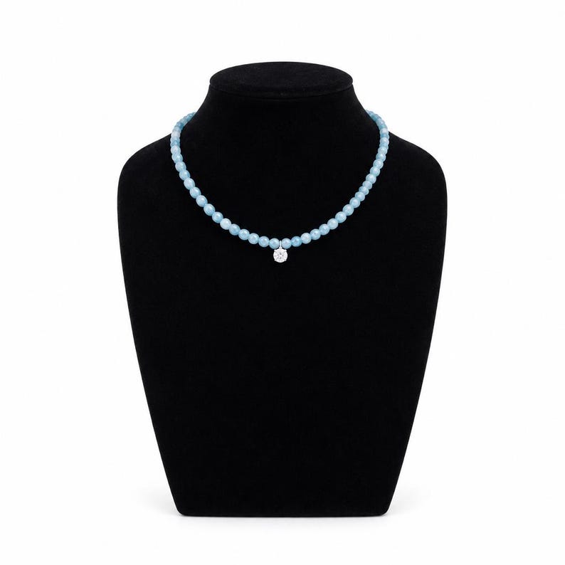 Necklace laid flat showing full design