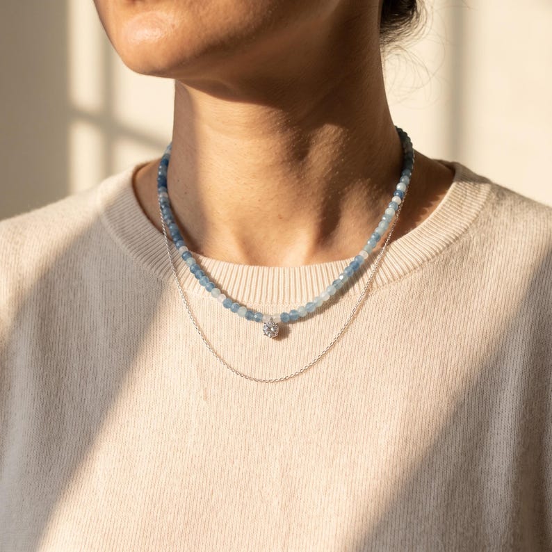 Model wearing aquamarine moonstone necklace