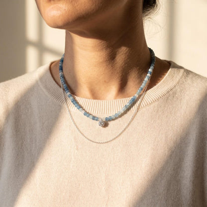 Model wearing aquamarine moonstone necklace