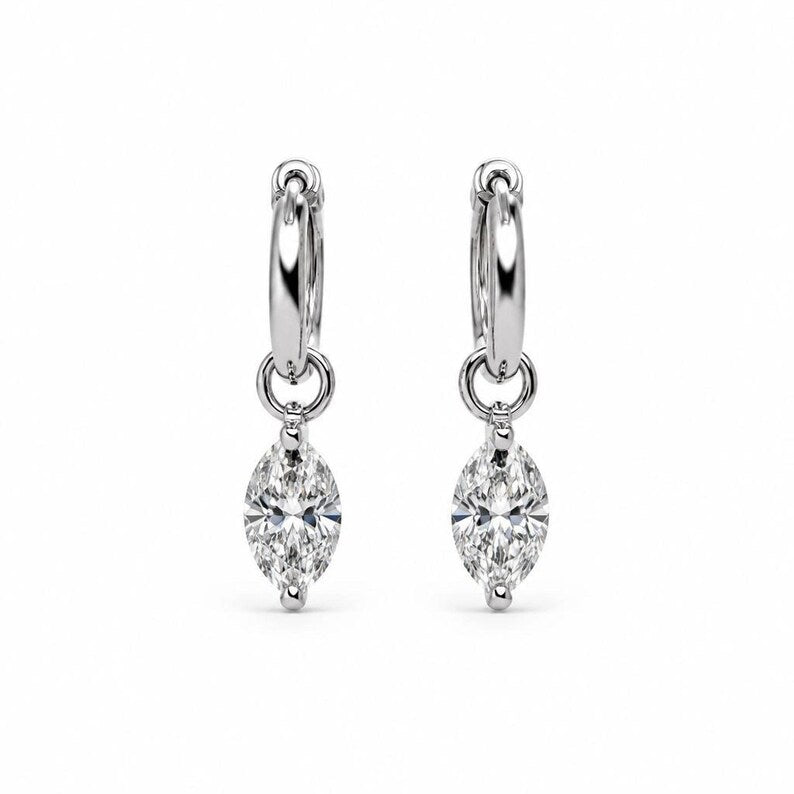 Product rendering of moissanite huggie hoop earrings