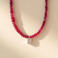 Ruby beaded necklace with emerald-cut moissanite pendant