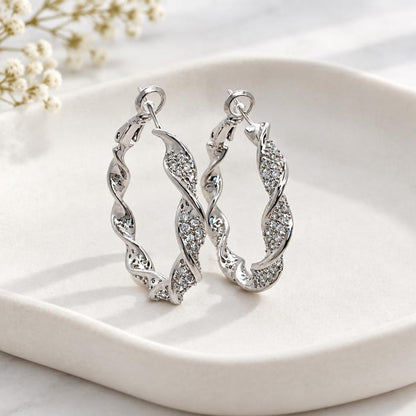 Twisted crystal pave hoops in natural light