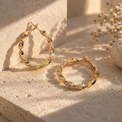 Gold and silver twisted crystal pave hoop earrings