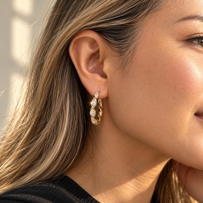 Gold twisted crystal pave hoop earring detail