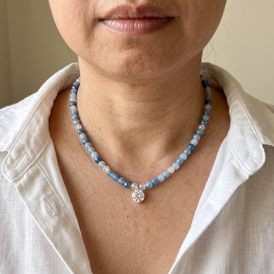 Close-up of aquamarine and moonstone beaded necklace