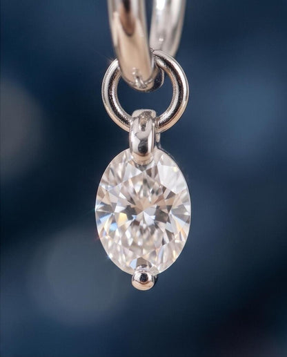 Macro shot of oval moissanite stone in floating setting