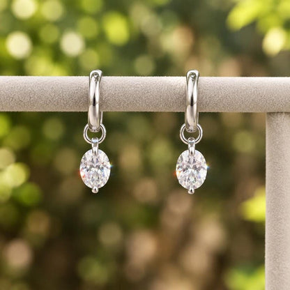 Moissanite huggie earrings on display bar